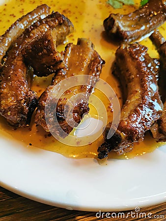 lunch in the restaurant fried pork ribs in honey sauce Stock Photo