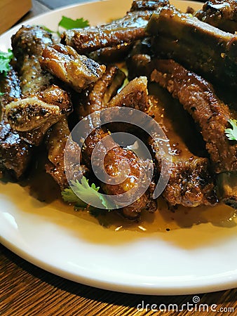 lunch in the restaurant fried pork ribs in honey sauce Stock Photo