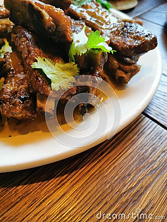 lunch in the restaurant fried pork ribs in honey sauce Stock Photo