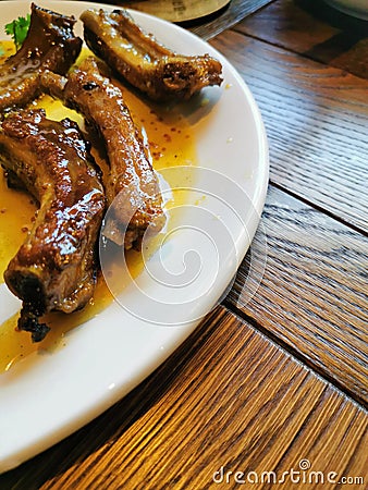 lunch in the restaurant fried pork ribs in honey sauce Stock Photo