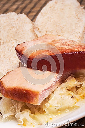 Lunch, Smoked meat with sauerkraut and home made dumplings Stock Photo