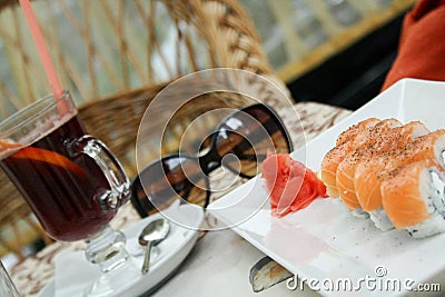 Lunch sushi and tea at a Chinese restaurant on the summer terrace Stock Photo