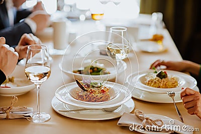 Lunch tablecloth with wine and spaghetti in restaurant Stock Photo