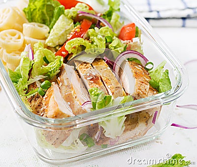 Lunchbox. Lunch box with grilled chicken fillet and pasta salad Stock Photo