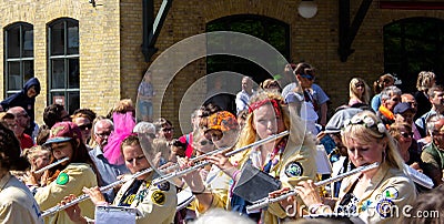 Lund, Sweden - May 19, 2018: Some women students playing the flute as they participate in the parade called Lundakarnevalen Editorial Stock Photo