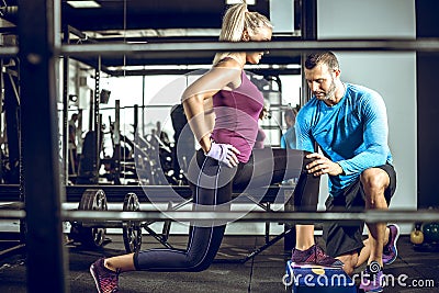 Lunge exercise with personal trainer Stock Photo