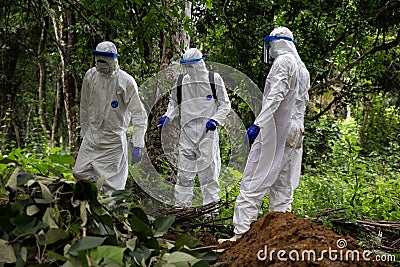 Lunsar, Sierra Leone, June 24, 2015: the burial team disinfects and prepare to burn used equipment. ebola response epidemic Editorial Stock Photo