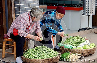 Luo Dai, China: Women Selling Vegetables Editorial Stock Photo