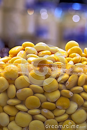 Lupine pickled for sale in market stall Stock Photo