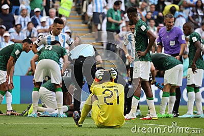 Mohammed Al Owais cries when injuring his partner during the match between Argentina National Team vs. Saudi Arabia National Team Editorial Stock Photo