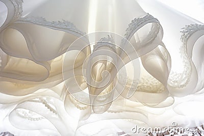 Lush hem bottom of the wedding dress, cloaks and ruches Stock Photo