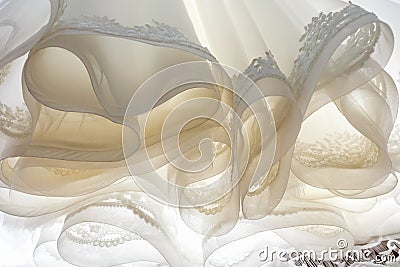 Lush hem bottom of the wedding dress, cloaks and ruches Stock Photo