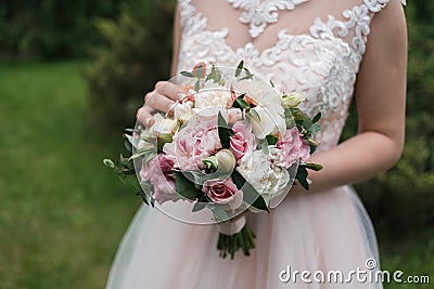 Lush wedding bouquet of white and pink peonies, roses. Stock Photo