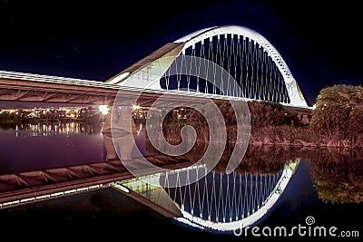 Lusitania bridge over Guadiana River at night Stock Photo