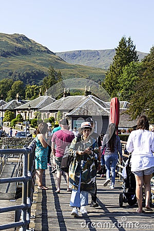 Luss, Argyll & Bute, Scotland, August, 25, 2019: Hundreds of people visit a small picturesque village on the west bank of Loch Lom Editorial Stock Photo