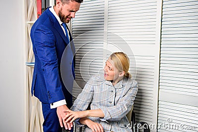 Lustful boss touching. Businessman Sexually Harassing Female Colleague. Female with disgusting face. Stock Photo