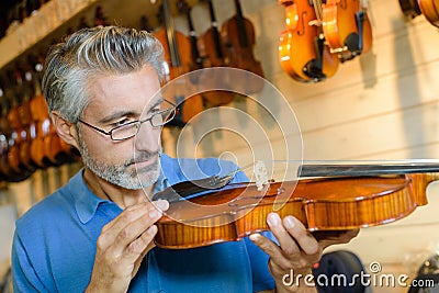 Luthier focused on job Stock Photo