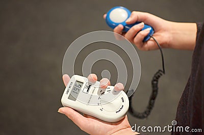 Lux meter for measuring light intensity in hand Stock Photo