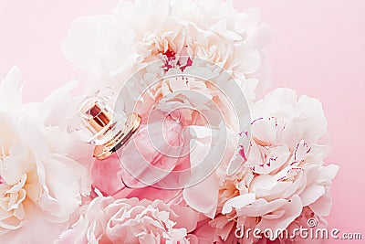 Luxe fragrance bottle as girly perfume product on background of peony flowers, parfum ad and beauty branding Stock Photo