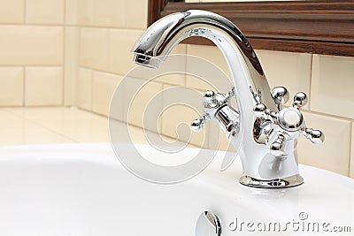 Luxurious Bathroom close-up - sink, faucet, tile Stock Photo