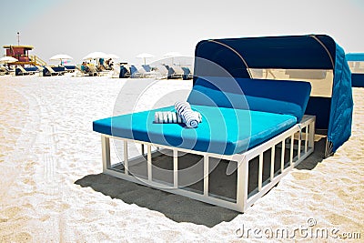 Luxurious beach bed with canopy on a sandy beach Stock Photo