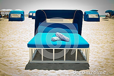 Luxurious beach bed with canopy on a sandy beach Stock Photo