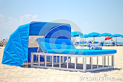 Luxurious beach bed with canopy on a sandy beach Stock Photo