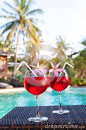 Luxurious beach hotel, two beautiful exotic cocktails near swimming pool, holidays Stock Photo