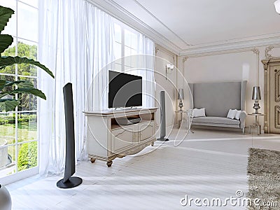 Luxurious bedroom with a large sofa and TV unit the large window Stock Photo