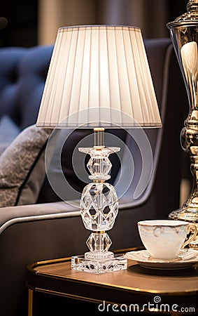 Luxurious crystal lamp with white shade, adding elegance to any room Stock Photo