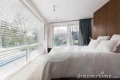 Luxurious interior designed bedroom with amazing view of the poo Stock Photo