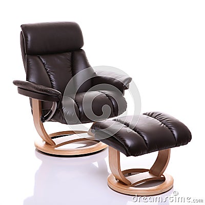 Luxurious leather recliner chair with footstool Stock Photo