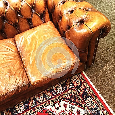 Luxurious leather sofa and ornamental rug Stock Photo