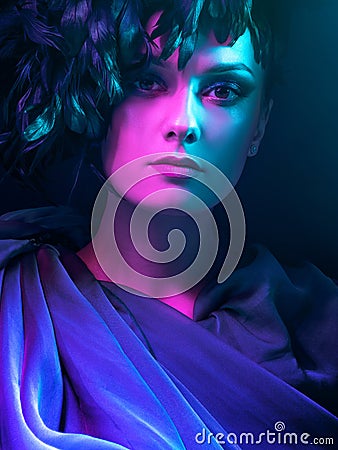 Luxurious mystical portrait, femme fatale in neon light. Stock Photo