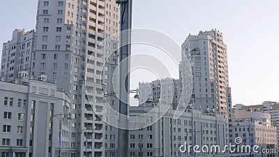 Luxurious new apartament house with a white facade. Stock footage. Summer city street and the complex of buildings Stock Photo