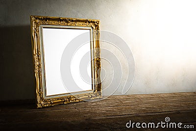 Luxurious photo frame on wooden table over grunge background Stock Photo