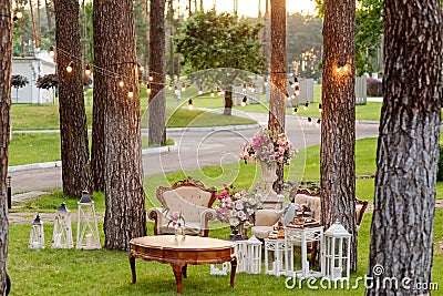 Luxurious photo zone on the green lawn. A place for beautiful pictures at wedding, birthday. Relax reception zone Stock Photo