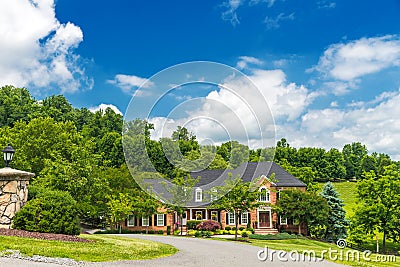 Luxurious red brick country house for a large family. with a large lawn and landscaping Editorial Stock Photo