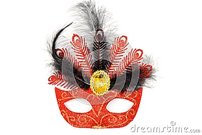 Luxurious red masquerade mask with feathers Stock Photo