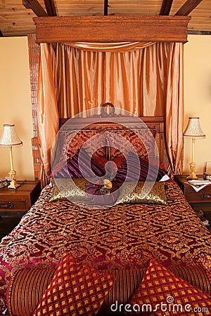 Luxurious red purple bed Stock Photo