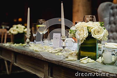 Luxurious romantic party table setting lit by candles, elegant ballroom for wedding reception, decoration ideas Stock Photo