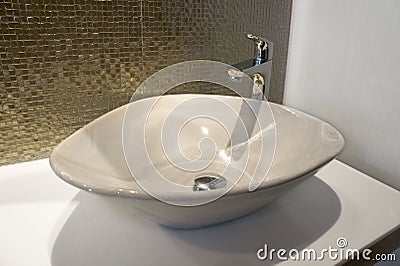 Luxurious ron sparks green gold mosaic and sink on bathroom Stock Photo