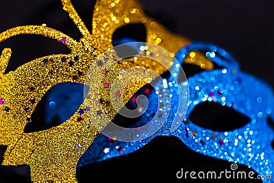 Luxurious Venetian shiny masks on a dark background. Carnival masquerade fantasy mask. Holiday and party concept Stock Photo