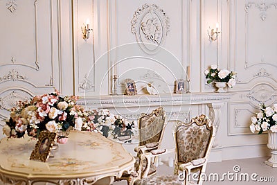 Luxury apartment, comfortable classic living room. Luxurious vintage interior with fireplace in the aristocratic style. Stock Photo