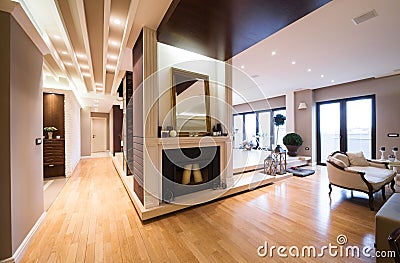 Luxury apartment interior with fireplace filed with candles Stock Photo