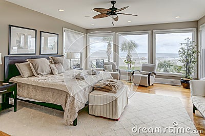 Luxury beach view bedroom looking out onto palm trees and the ocean Stock Photo