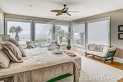 Luxury beach view bedroom looking out onto palm trees and the ocean Stock Photo