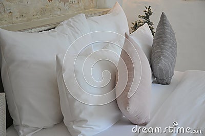 Luxury bedroom, King bed with white linens and pillows. Stock Photo