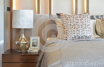 Luxury bedroom with white lamp with picture frame on table Stock Photo