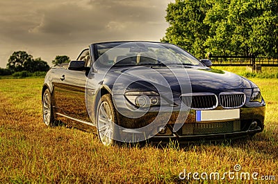 Luxury bmw cabriolet in rural scene, hdr Stock Photo